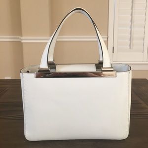 White Michael Kors handbag.