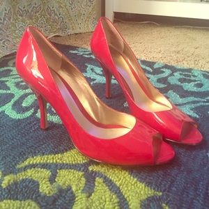 Red peep toe pumps