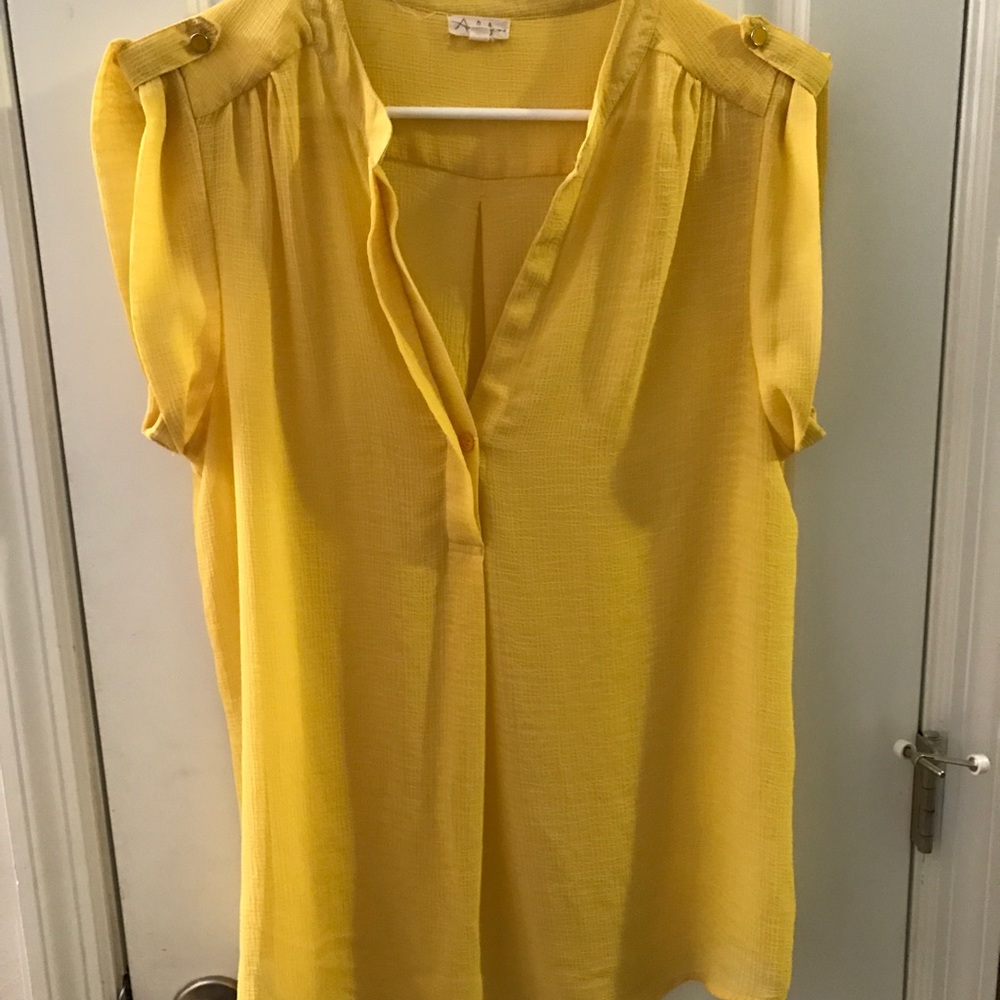Yellow polyester blend... never worn