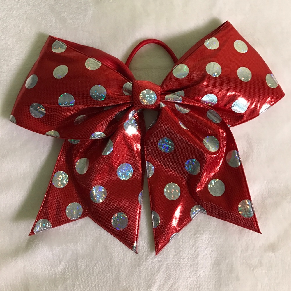 Red polka dotted cheer bow.