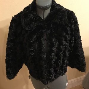 Black formal fur caplet.