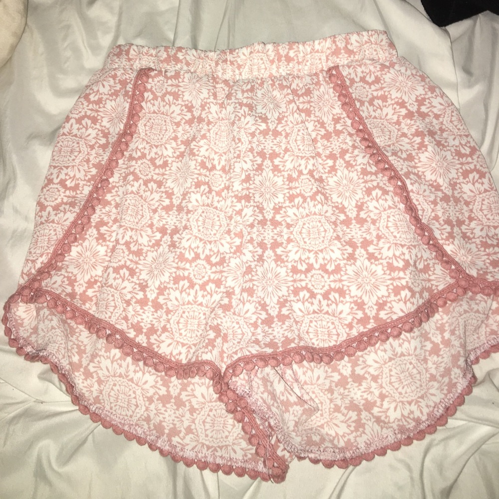 Charlotte Russe pink shorts with white flowers.
