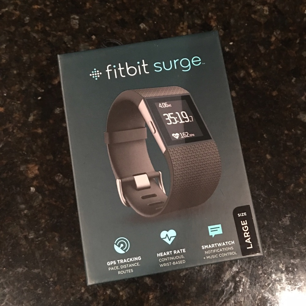 New in box FitBit Surge