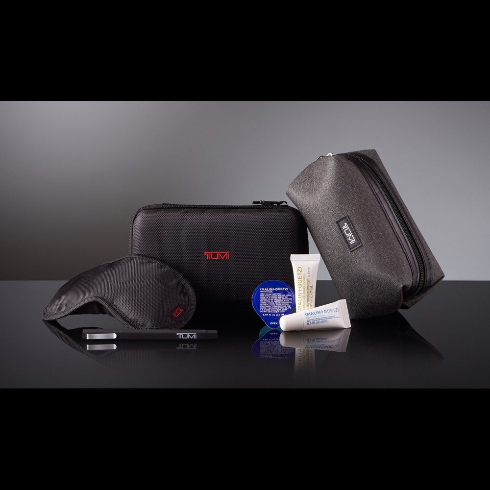 Two Tumi bags and amenity kits