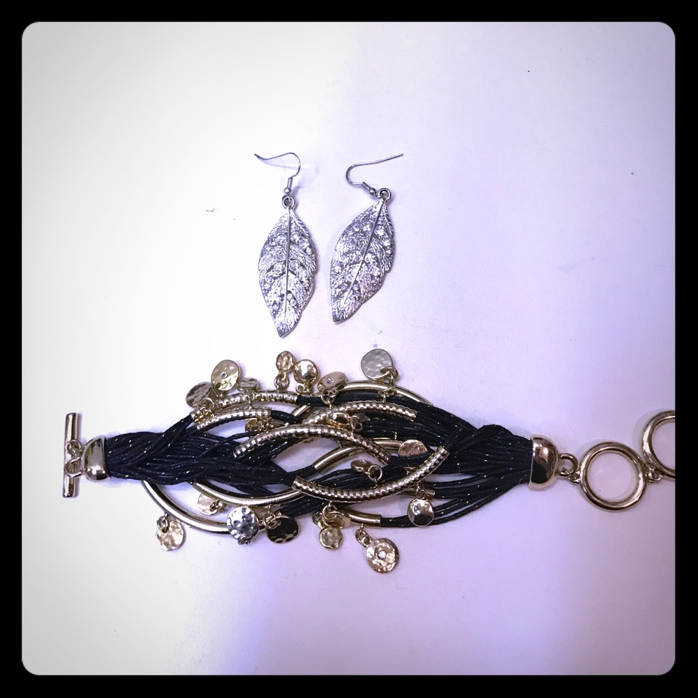 Stylish layered bracelet and feather earrings