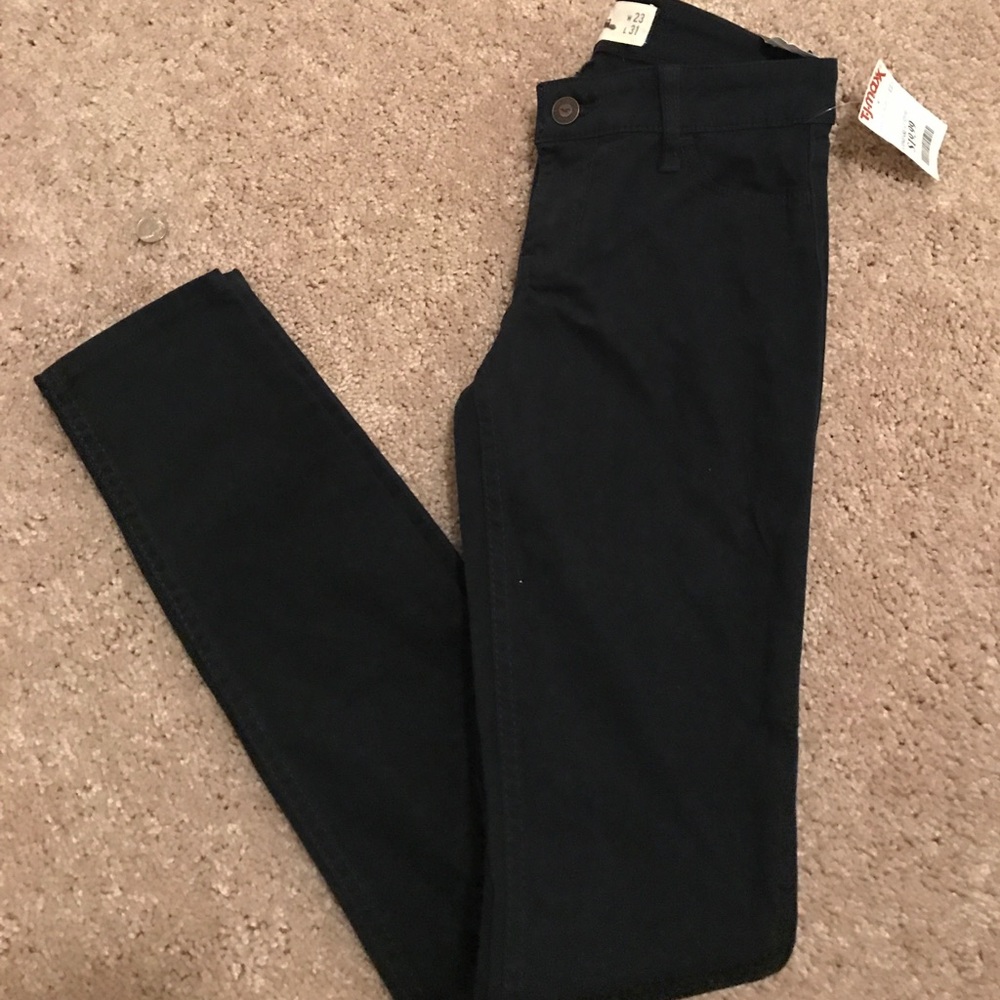 Hollister super skinny jeans in a deep blue color.