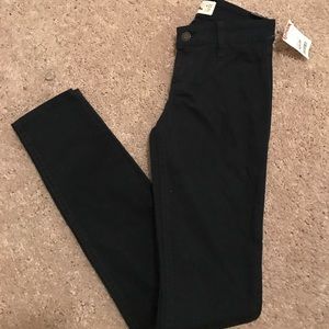 Hollister super skinny jeans in a deep blue color.