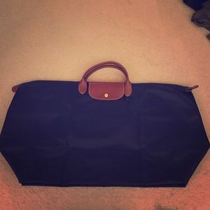 Beautiful navy blue long champs luggage.