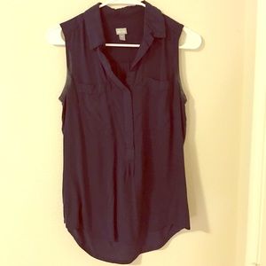 Navy blue sleeveless, button-up top with pockets