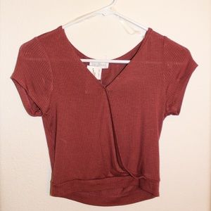 Cropped Top with slit down the middle.