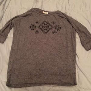 Grey sweater with black design