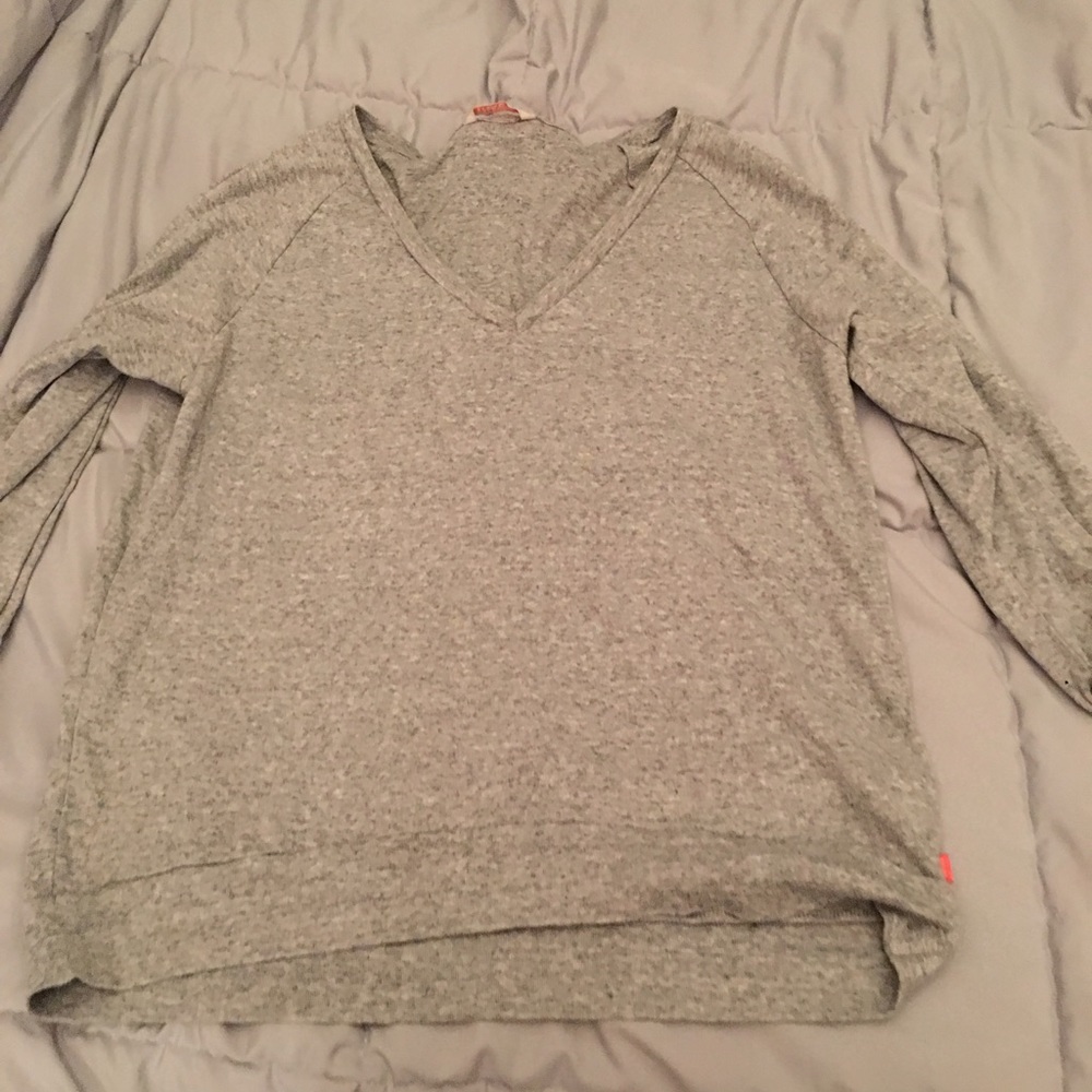 Grey v neck sweater in a medium
