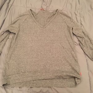 Grey v neck sweater in a medium
