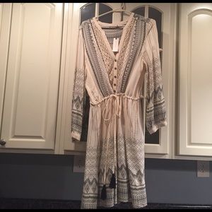 Cream long-sleeved dress with black design