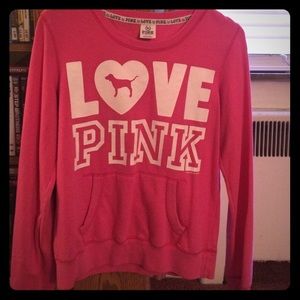 Pink/white crew neck sweatshirt.