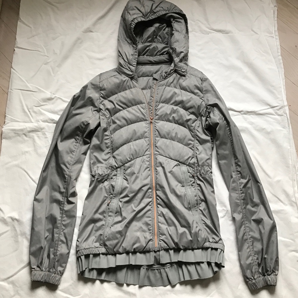 Flattering windbreaker with detachable hood.