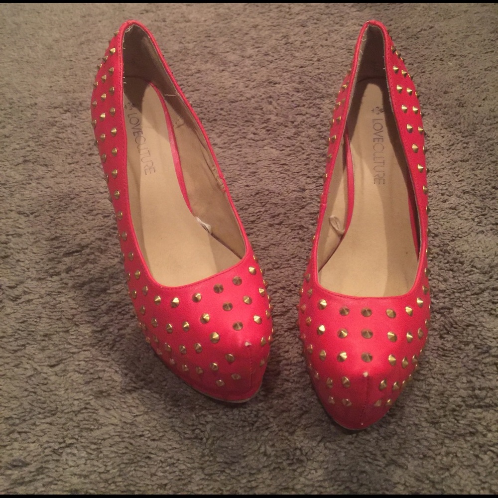 Red spike heels