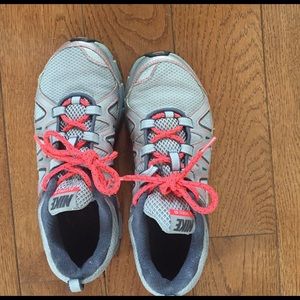 Gray and coral Nike tennis shoes