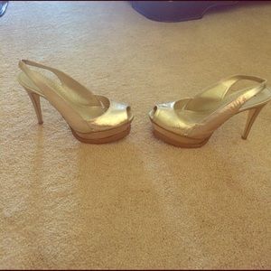 Bebe size 8 Gold heel with platform.
