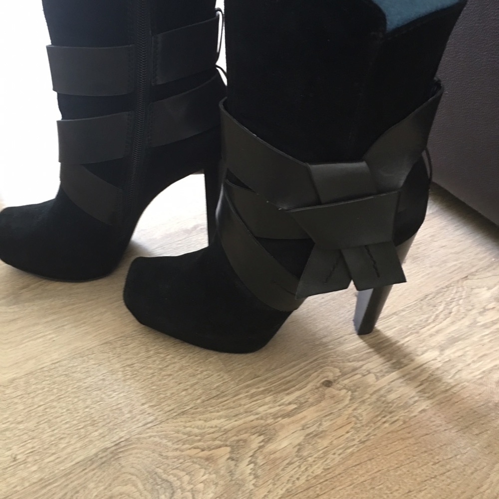 Black suede boots with leather bow detail