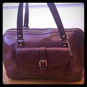 Burgundy colored Coach handbag