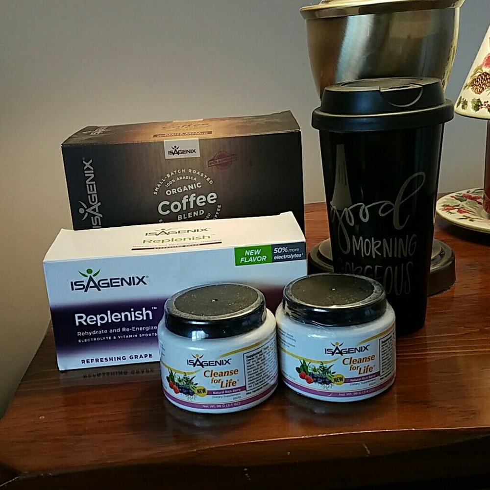 Various Isagenix products and a drink tumbler