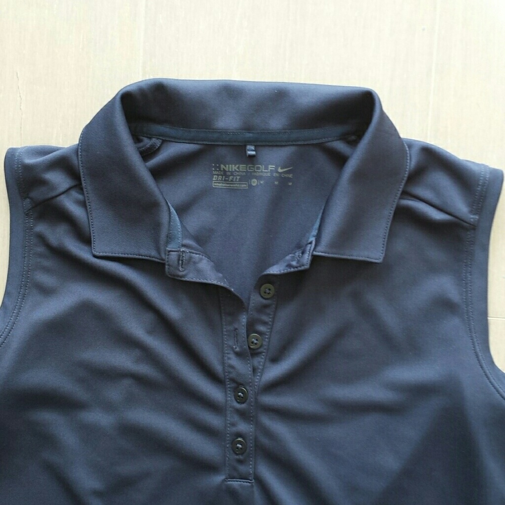 Nike women's sleeveless navy golf shirt.