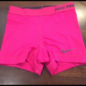Bright pink Nike pro spandex shorts