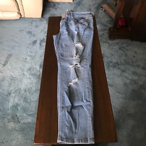 Refuge Jeans. Distressed light wash denim.