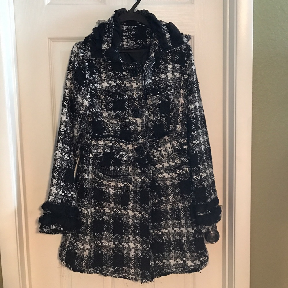 Black and white plaid coat.