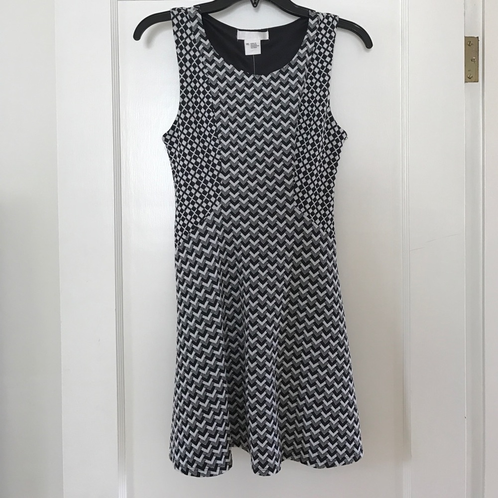 Never worn dress, beautifully fitted.