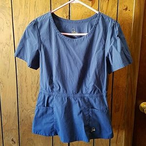 Jaanuu Peplum Scrub Top