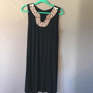 Knee length black dress with Aztec detail