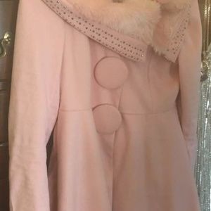 Pink stroller with faux fur collar and metal studs