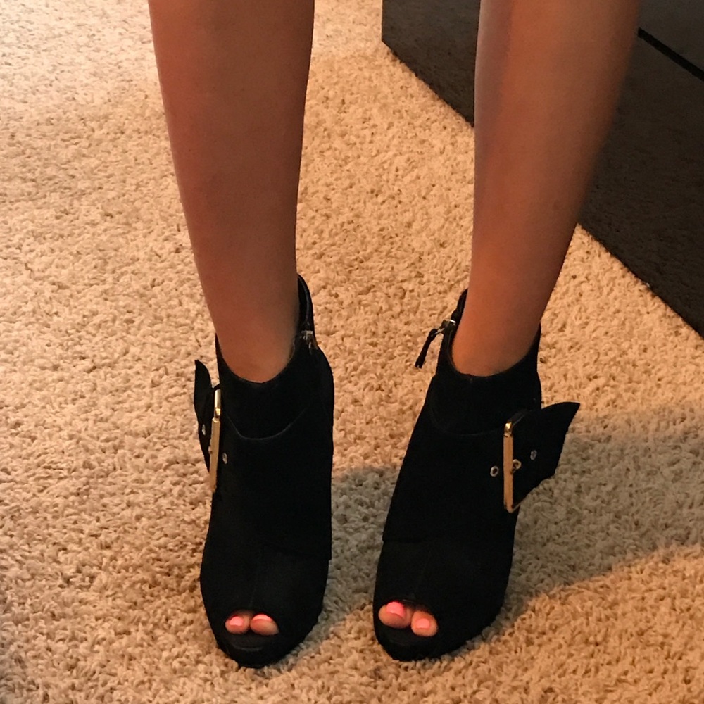 Black booties with gold buckle