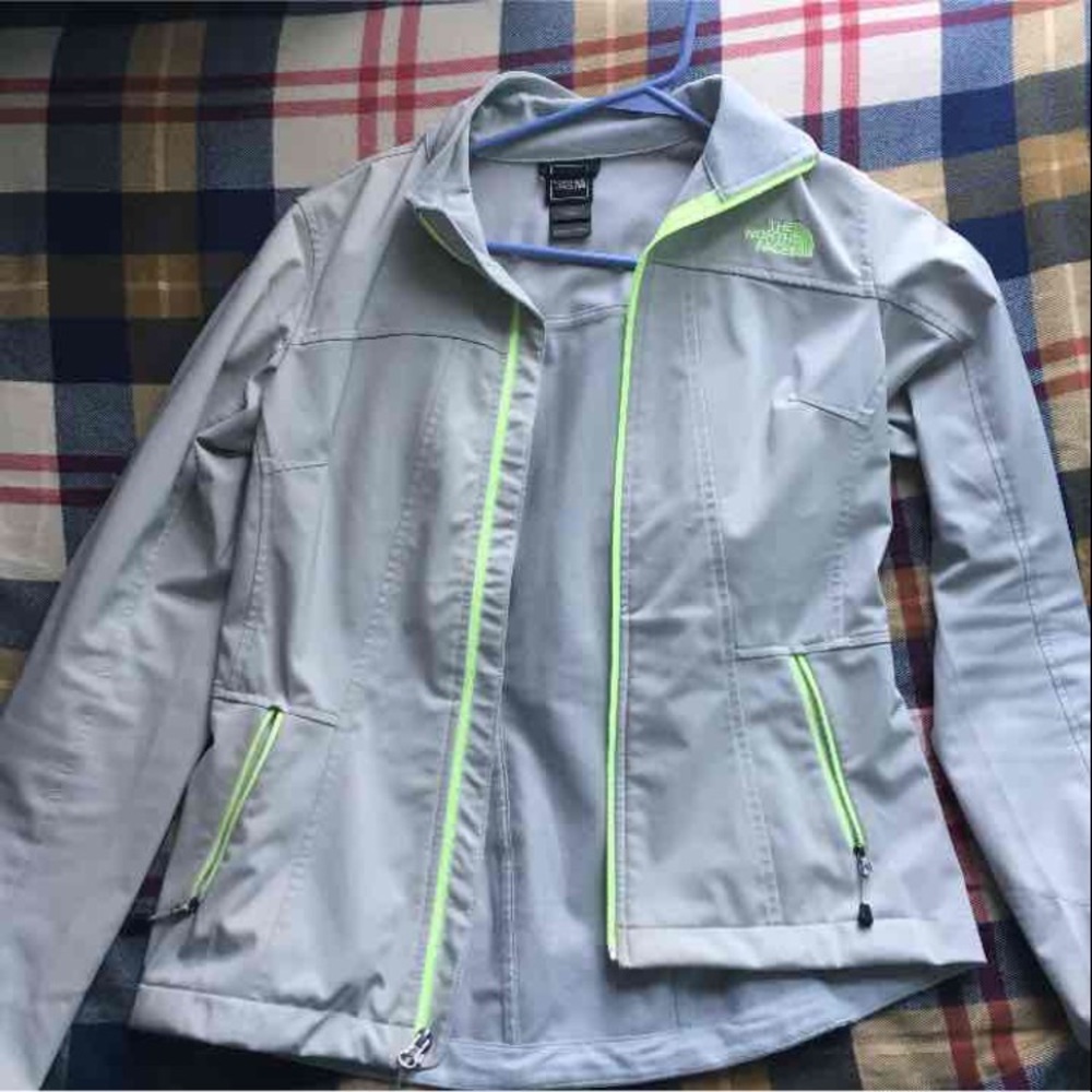 Green and grey north face light jacket