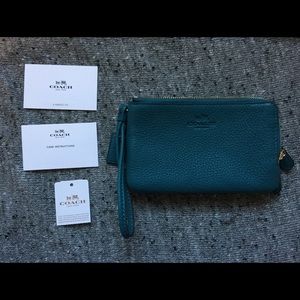 Teal-blue Coach Wristlet