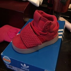Red Adidas sneakers