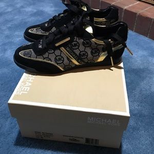 Gold and Black Michael Kors sneakers.