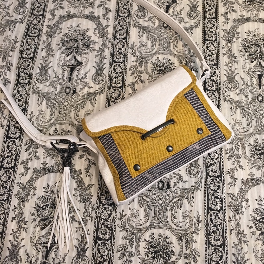 Cross body leather and fabric bag.