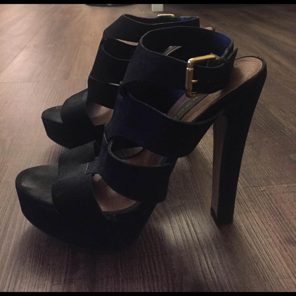 Black suede pumps with ankle strap