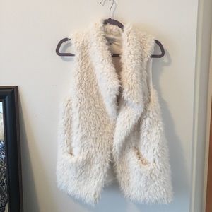 White fur vest with pockets