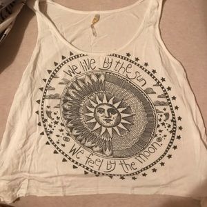 "We live by the sun we feel by the moon" tank