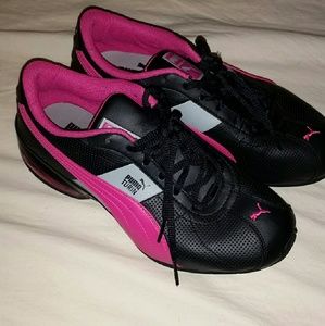 Pink and black Pumas