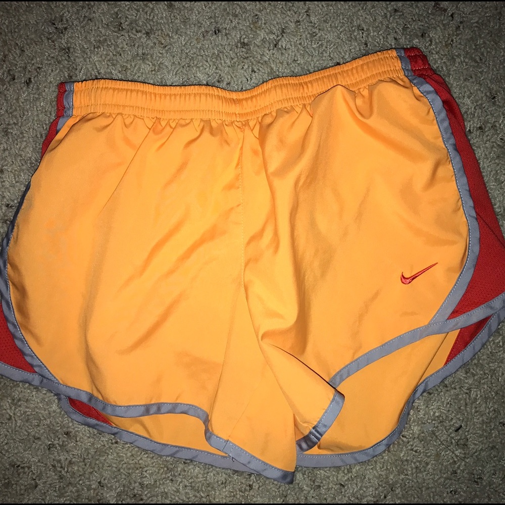 Two pairs of athletic shorts. One Nike, one UA.