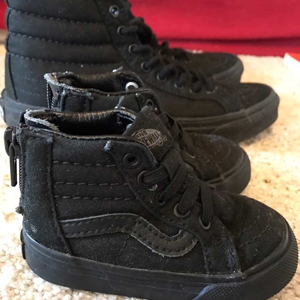 Black Vans high top skater shoes
