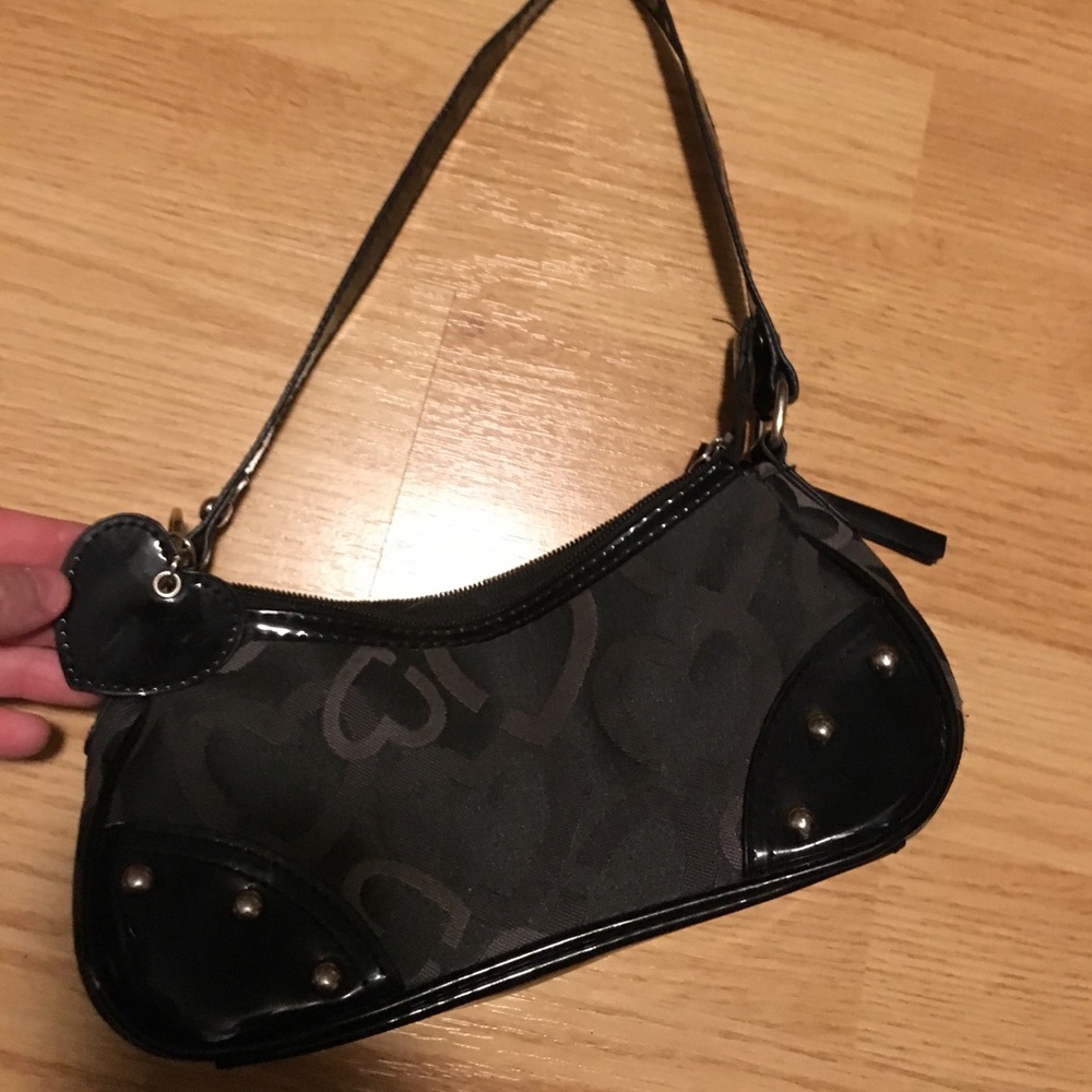 Small black purse with hearts and heart charm