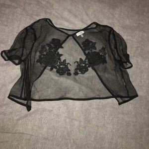 black mesh crop top with floral embellishment