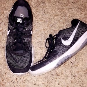 Black Nike Fury running shoes