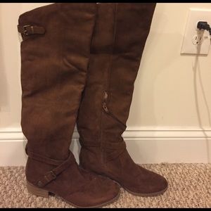 Over the knee brown boots.